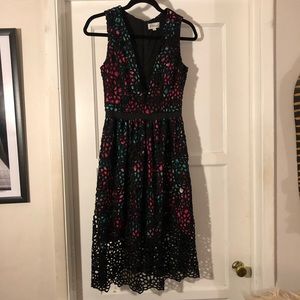 Heavy lace dress with plunging neckline